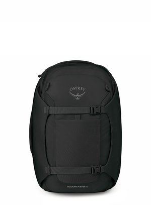 Mochila de viaje negra Osprey Sojourn Porter 46 con correas de compresión y compartimento frontal con cremallera, vista desde arriba.