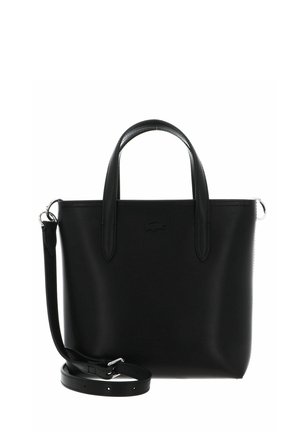 Black leather tote bag with two handles and an adjustable shoulder strap, featuring a subtle embossed logo on the front.