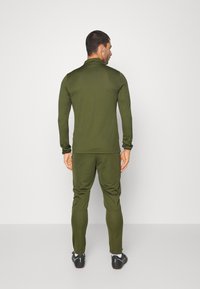 Nike Performance M NK DRY ACD21 TRK SUIT K - Fato de treino - rough green/white