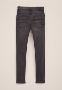 Jeans skinny en denim gris avec une taille mi-haute, cinq poches et des coutures contrastées. Présente une étiquette de logo à la taille arrière.