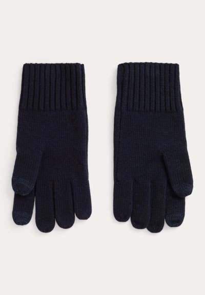 Tamsiai mėlynos megztos pirštinės su ribuotu rankogaliu, turinčios penkis pirštus ir lygią tekstūrą. Nėra matomų raštų ar papildomų detalių.