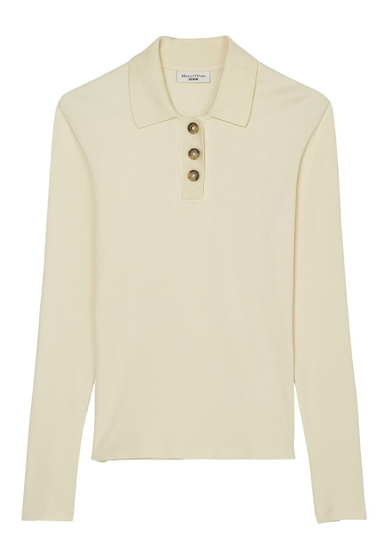 Krämfärgad långärmad polo skjorta gjord av ribbat tyg. Har en krage och tre knappar vid halsringningen. Rakt passform.