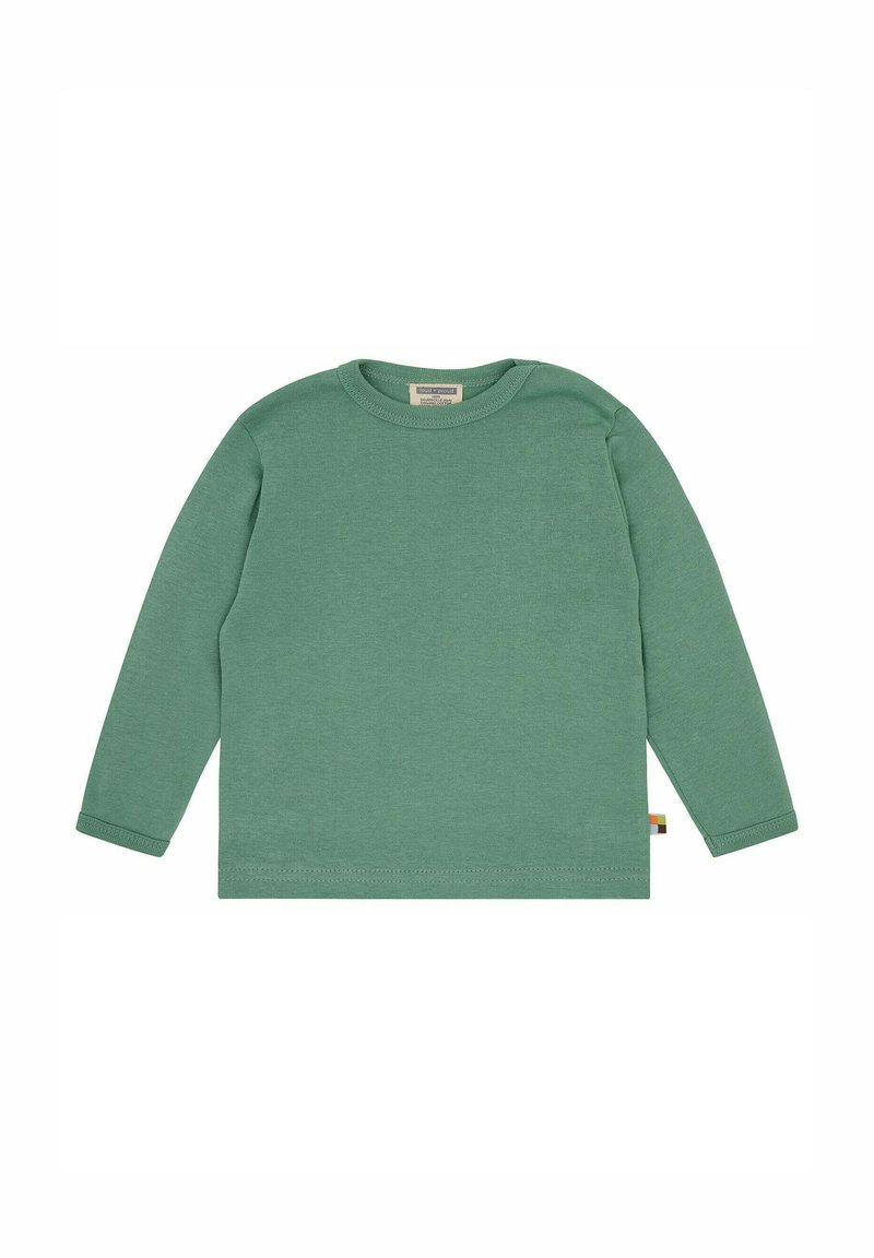 Maglietta verde a maniche lunghe in cotone, con scollatura rotonda e polsini a coste. Senza fantasie; sul lato c'è un piccolo dettaglio con etichetta multicolore.