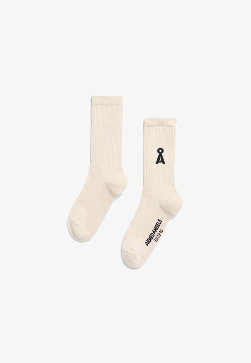Cremefarbene Baumwollsocken mit gerippter Textur. Auf der Seite befindet sich ein schwarzes grafisches Logo und Markentext. Standard Sockengestalt.