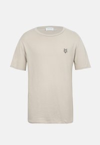 Μπεζ κοντομάνικο T-shirt με στρογγυλή λαιμόκοψη και μικρό μαύρο γεωμετρικό λογότυπο κεφαλής λύκου στο αριστερό στήθος.