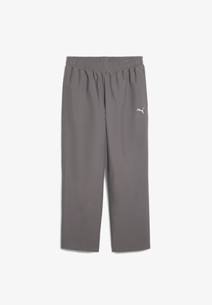 Grå träningsbyxor med elastisk midja, gjorda av lättviktigt material. Har en liten vit logotyp på vänster ben.