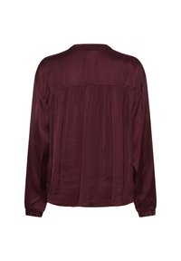 Burgundy satin blouse with long sleeves, a relaxed fit, and pleated detailing across the back. Smooth texture and minimalistic design.