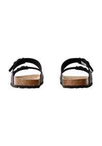 Sandales noires avec sangles réglables, semelle en liège plate et semelle en caoutchouc. Conçues pour le confort, elles arborent un style minimaliste.