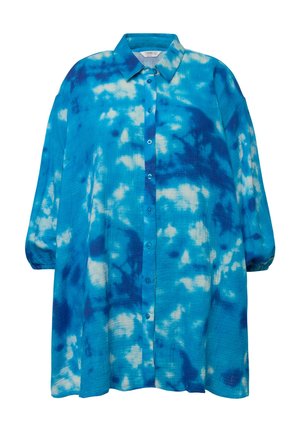 Chemise surdimensionnée à boutons dans un motif tie-dye bleu. Fabriquée en tissu texturé avec un col rabattu et de longues manches bouffantes.