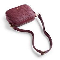 Maroon rectangular crossbody bag with woven texture, gold hardware, and a zip closure. Features a detachable, adjustable strap.