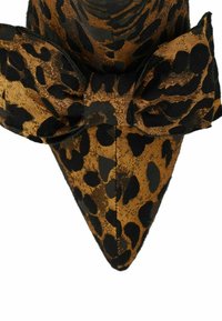 Leopard print pointed-toe shoe in brown and black fabric, featuring a large matching bow on the front. Textured surface with a glossy finish.