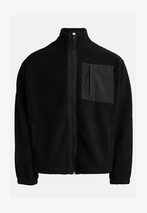 Black, zip-up jacket made of textured fleece, featuring a left chest pocket with a contrasting material and side pockets.
