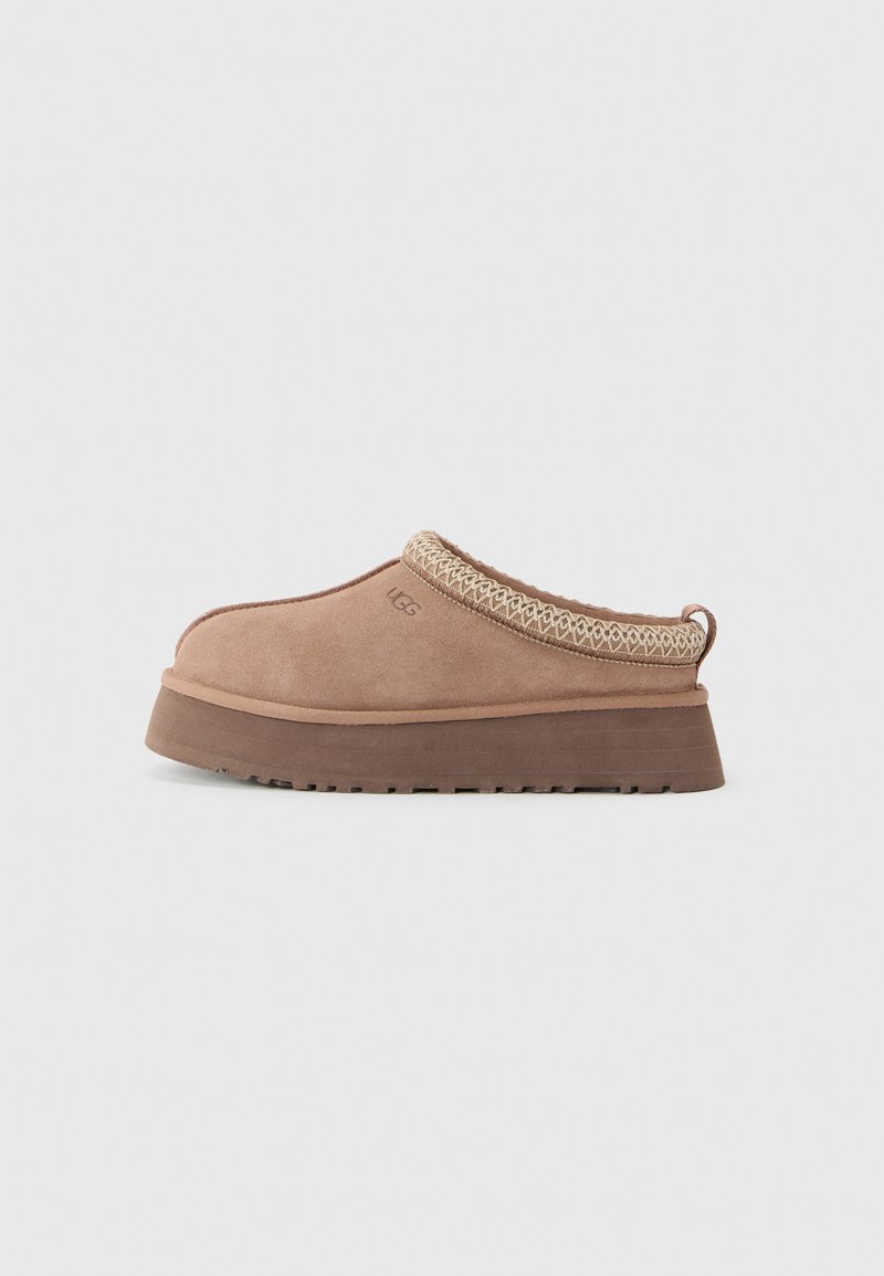 Slip-on tan suede clog with thick brown sole and knitted trim, designed for casual wear by UGG.