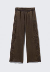 Bruine wijduitlopende broek met een elastische tailleband, voorzien van ingewikkelde donkere bloemapplicaties langs de zijkanten en zijzakken.