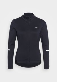 Black long-sleeve cycling jersey with a high collar, featuring a GORE logo on the chest and white reflective stripes on the sleeves.