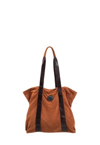 Brązowa torba tote z korduroju, z czarnymi skórzanymi uchwytami i okrąłym czarnym guzikiem na środku. Posiada luźny, miękki design.