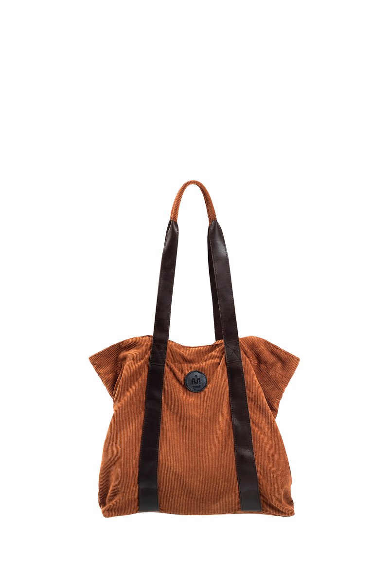 Brązowa torba tote z korduroju, z czarnymi skórzanymi uchwytami i okrąłym czarnym guzikiem na środku. Posiada luźny, miękki design.