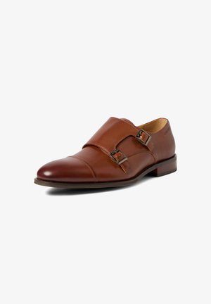 Brown leather men's dress shoe with double monk strap buckles and a low stacked heel, angled to show outer side.