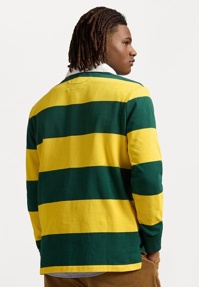 Langsleevenshirt met dikke groene en gele horizontale strepen, met een witte kraag en een gestructureerde stof. Gedetailleerde stiksels op de rug.