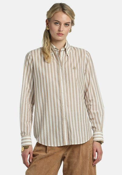 Light beige and white striped button-up shirt with a classic collar, long sleeves, and embroidered logo on the chest. Soft, textured fabric.