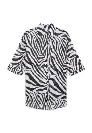Koszula zapinana z przodu z wzorem w zebry w odcieniach czerni i bieli, krótki rękaw i kołnierzyk. Wykonana z lekkiej tkaniny.