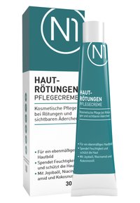Türkisfarbige Tube mit der Aufschrift "Haut-Rötungen Pflegecreme" und weißem Verschluss, verpackt in einer passenden Schachtel mit mehrsprachigem Text und einfachen Grafiken.