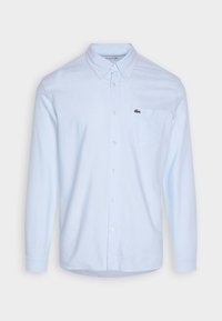 Lichtblauwe button-up overhemd van katoen met lange mouwen, button-down kraag, borstzak en een klein geborduurd logo op de zak.