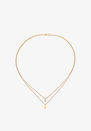 Collana a strati in tono dorato con due catene. Presenta un pendente circolare e una piccola pietra preziosa, creando un design delicato. Texture liscia.