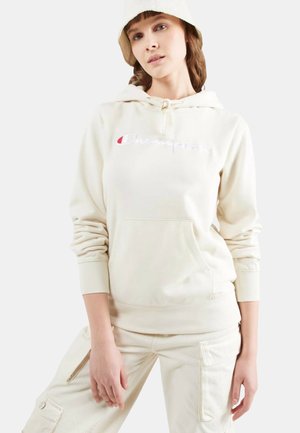 Hanorac din fleece de culoare crem, cu un buzunar frontal, glugă cu șnur și logo brodat "Champion" în alb și roșu pe piept.