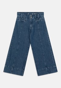 Traperice visokog struka širokih nogavica u tamnom denimu. Imaju prednje džepove, zatvaranje na dugme i preklopljen rub. Tekstuirana tkanina s vidljivim šavovima.