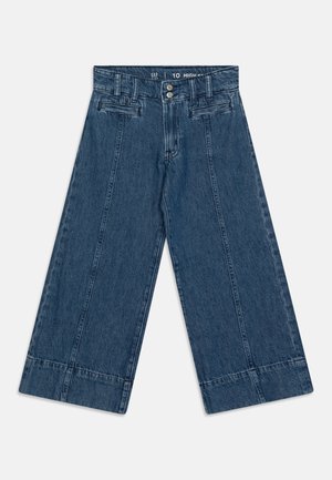 High-waisted wide-leg jeans in dark denim. Features front pockets, button closure, and folded hem. Textured fabric with visible stitching lines.