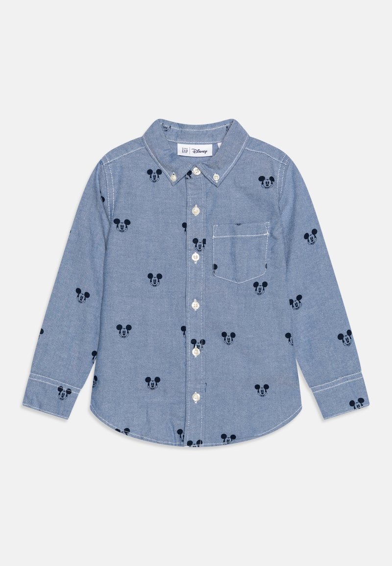 Chemise bleu clair à manches longues avec petits motifs de tête de Mickey Mouse noirs et une poche poitrine à l'avant.
