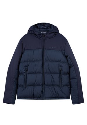 Giacca puffy blu navy con cappuccio, caratterizzata da un design trapuntato, tasche laterali con zip e un pannello superiore liscio.