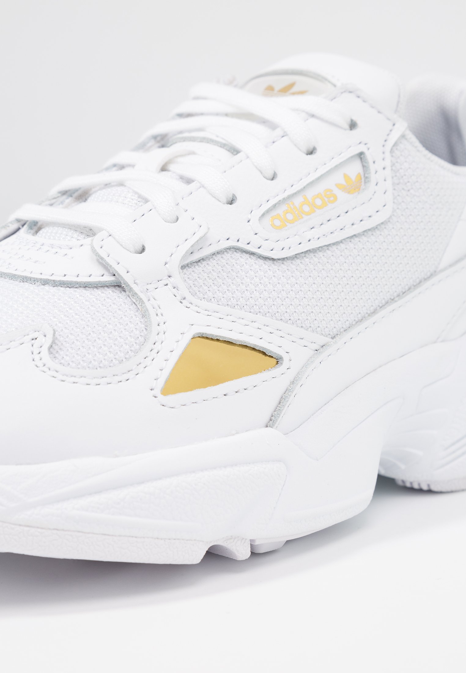 adidas originals gold metallic falcon trainers