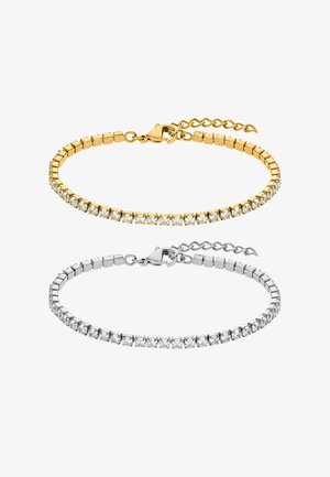 Braccialetti in oro e argento con pietre di zirconia cubica, caratterizzati da un design sottile e flessibile e da una chiusura a moschettone con una catena regolabile.