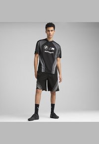 Puma - LIFESTYLE  - Spodnji deli trenirk - black Miniaturna slika 1