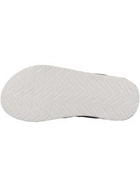 Black sneaker sole with a textured white rubber finish, featuring a geometric pattern for traction and stability.