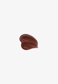 Smooth, glossy chocolate swirl with curved ridges on a plain white background.