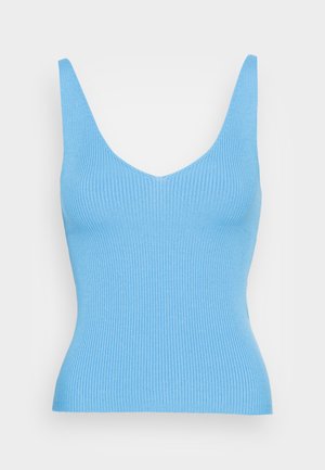 Light blue ribbed knit tank top with a deep V-neck and wide shoulder straps. The fit is form-flattering, enhancing the silhouette.