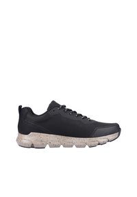 Black athletic shoes with a textured upper, featuring black laces and a chunky, speckled gray midsole. Rounded toe and padded collar.