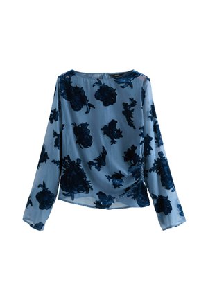 Mėlynas ilgomis rankovėmis viršus, pagamintas iš permatomo audinio su tamsiai mėlynomis gėlių raštais. Turi apvalų iškirpimą ir šoninius susiraukšlėjimo elementus.