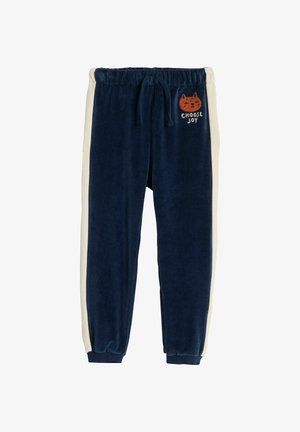 Granatowe welurowe spodnie dresowe z elastycznym paskiem w talii, kremowymi paskami po bokach oraz haftowaną twarzą kota z napisem "Wybierz radość". Ze ściągaczami przy kostkach.