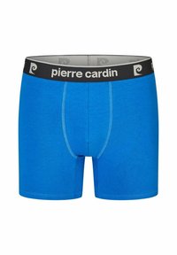 Blue boxer shorts with a black elastic waistband featuring the text "pierre cardin." Smooth texture with contrasting stitching details.