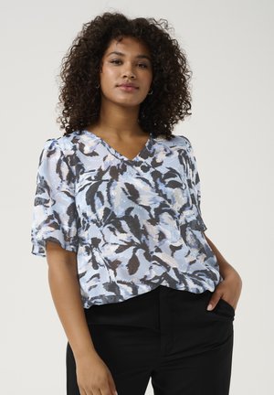 Flowy short-sleeve blouse in light blue with abstract gray and black patterns. Features a V-neck and a loose fit design.