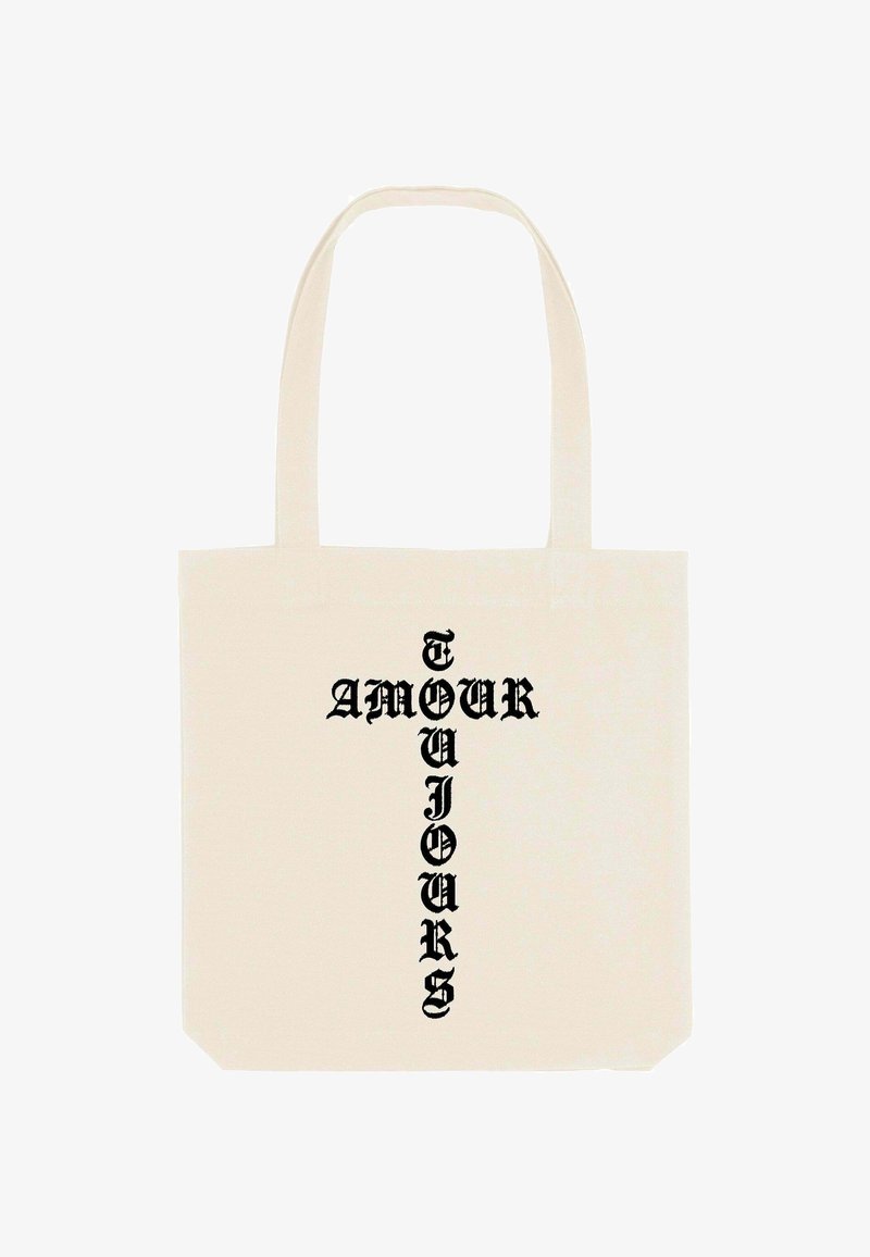 Sac en toile de coton de couleur crème avec du texte vertical noir indiquant "AMOUR TOUJOURS." Dispose de poignées robustes et d'une forme structurée.