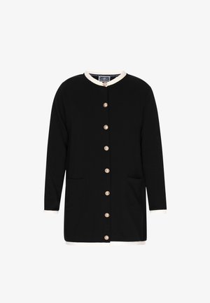 Must black cardigan pika pikkade varrukatega, valge krae ja mansettidega. Esiosas on kuldsed nööbid ja kaks küljetaskut.