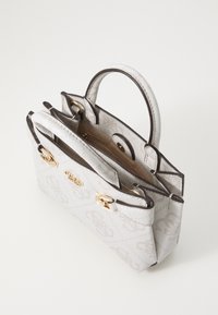 Light gray handbag with a textured fabric, dark brown trim, gold hardware, and double handles. Features a magnetic closure.