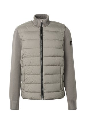 Lys grå hybridjakke med vattert, quiltet front, strikkede lange ermer, ribbestrikket krage og mansjetter, samt svart glidelåslukking.