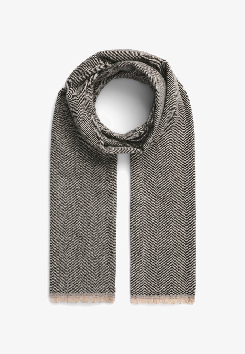 Szalik w wzór jodełki w odcieniach szaro-beżowych, z frędzlami na krawędziach. Wykonany z miękkiego materiału, charakteryzuje się lekką, teksturowaną strukturą.