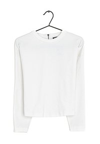 Haut blanc à manches longues en tissu doux, avec un col rond, une coupe décontractée et un détail de fermeture éclair à l'arrière. Sans motifs ni accents.